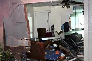 Update: Child injured when car runs through home on Poplar Ave.