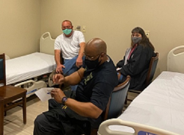 Emergency First Responders and Community Health Care Workers Receive Vaccine In Carthage